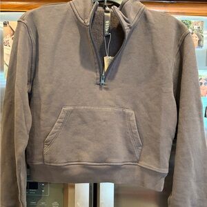 SKIMS Women's French Terry Shrunken Half zip sweatshirt. Official color is iron.